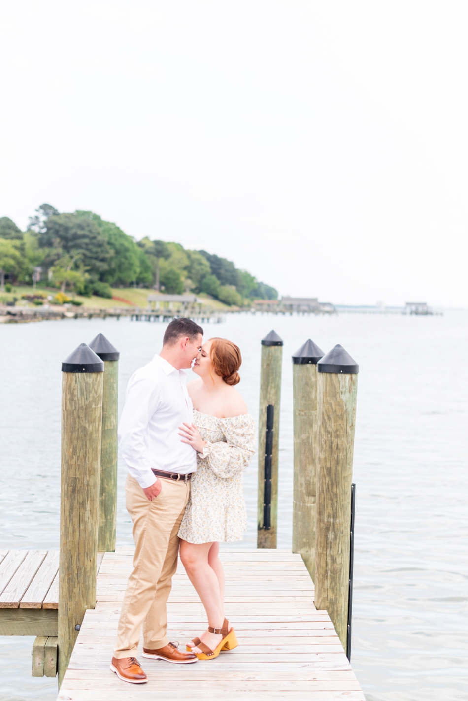 bride and groom kiss during engagement session with wedding photographer in Virginia