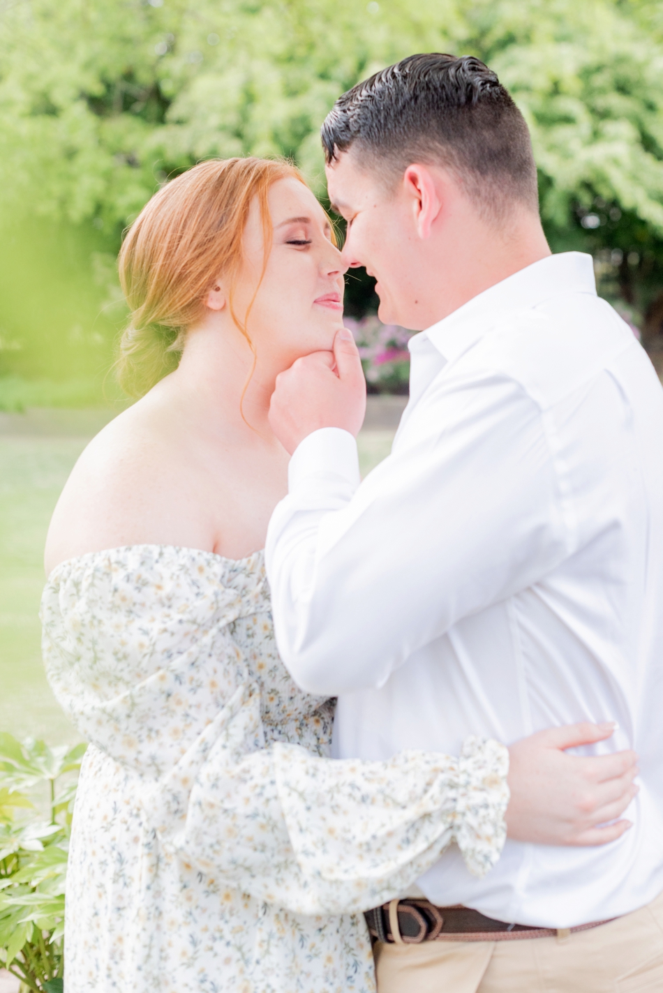 engaged couple about to kiss during engagement session at James River Country Club
